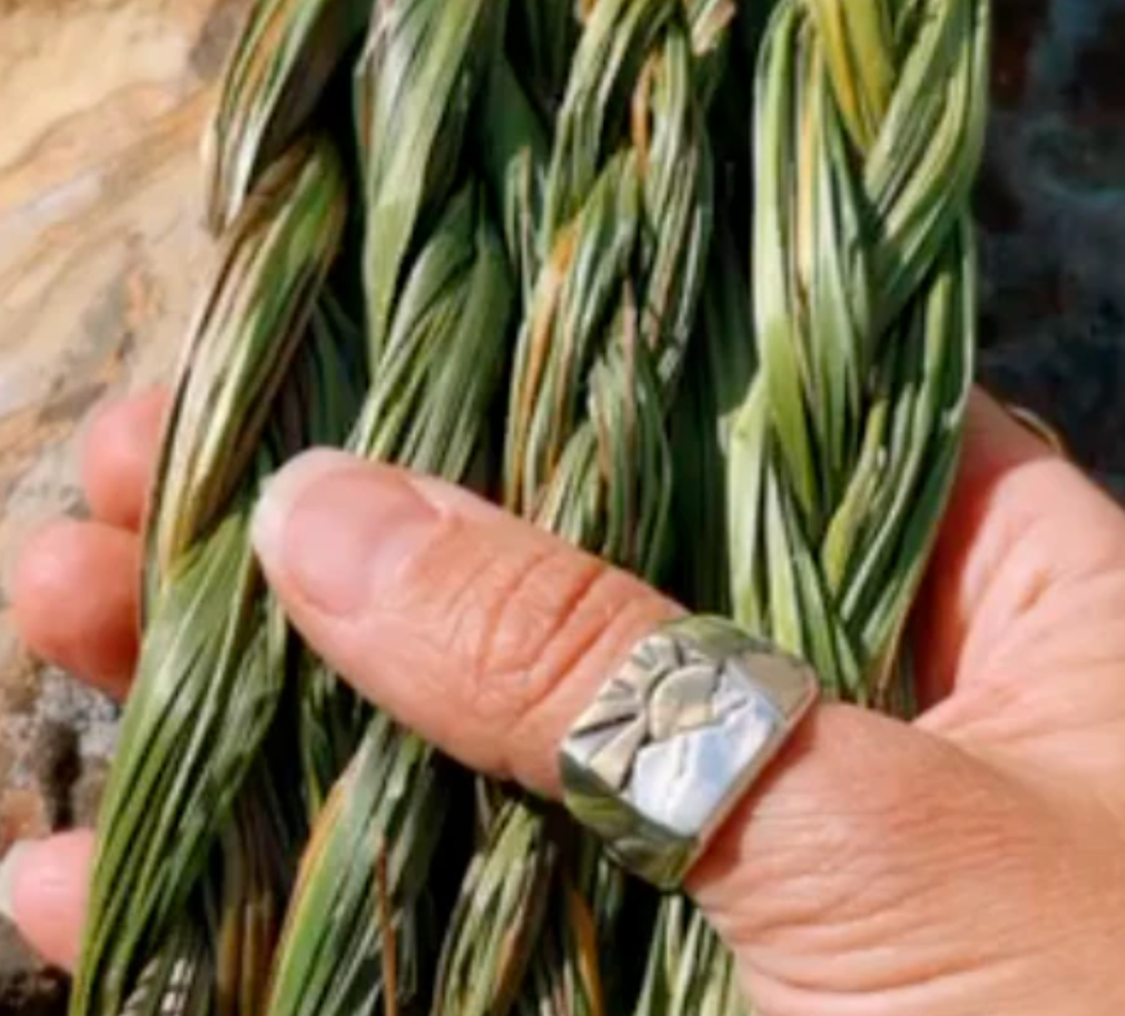 “Detail shot of Sweetgrass & Rose Energy Aligning Spray showing herbal-infused formula.”